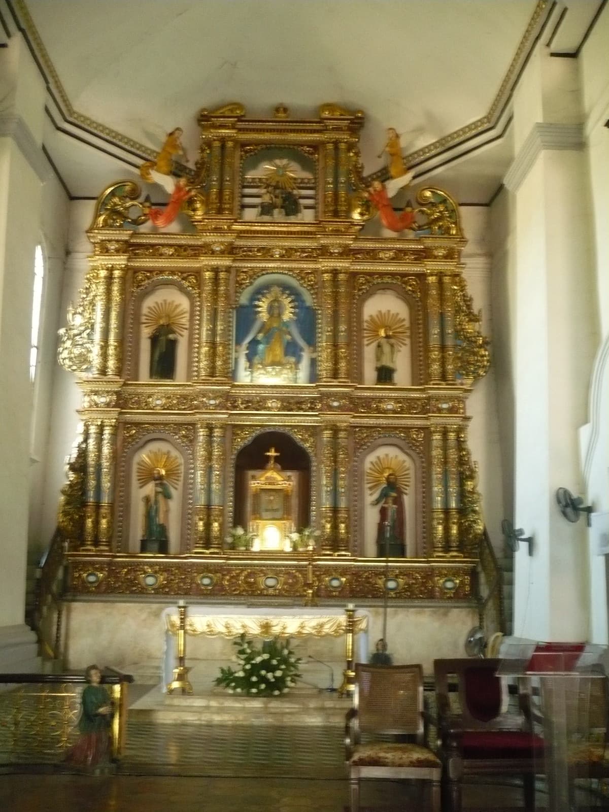 The gilded retablo of Our Lady of the Assumption in Maragondon church.